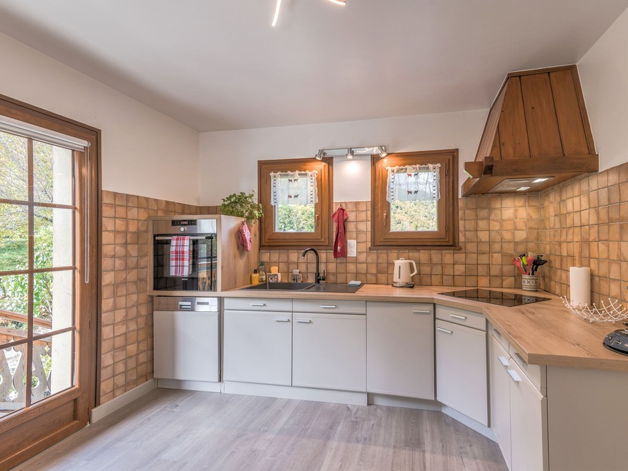 Kitchen with access to a west-facing balcony and terrace