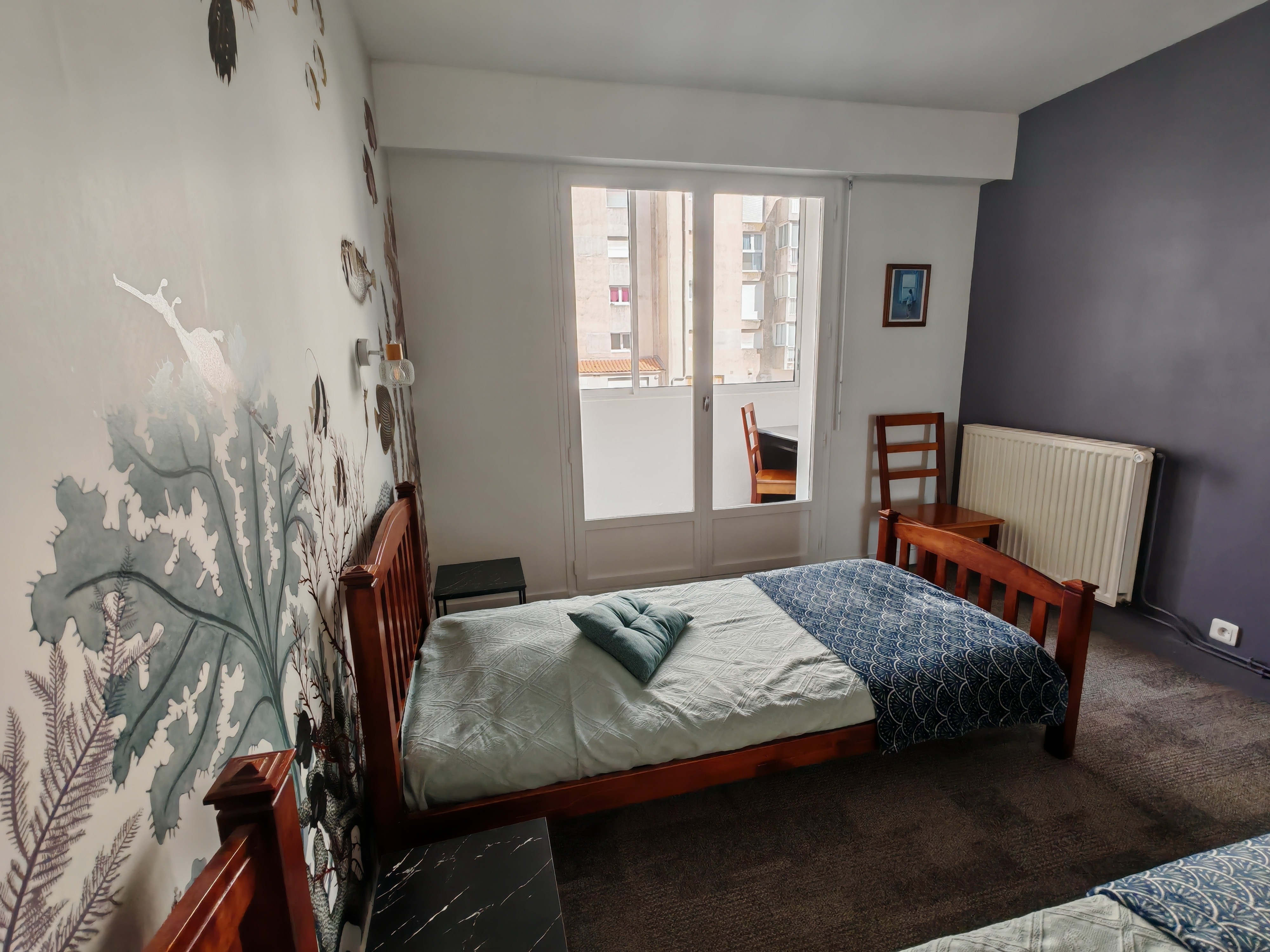 Bedroom 1 with access to a loggia and desk