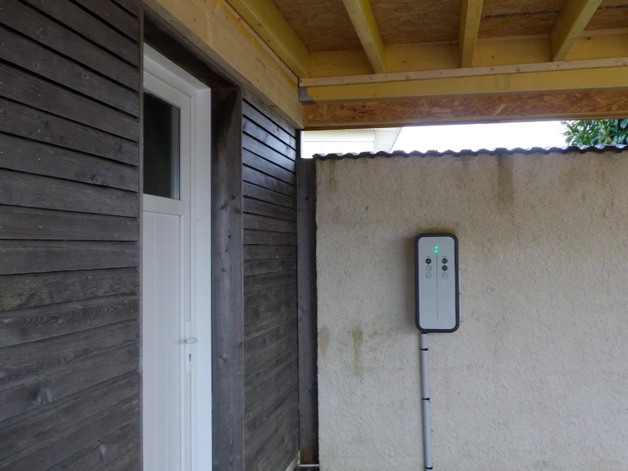 Electric car charging point under the car port