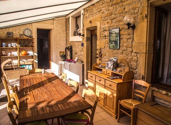 Véranda, coin détente, lecture - Chambre d'hôtes l'An XII