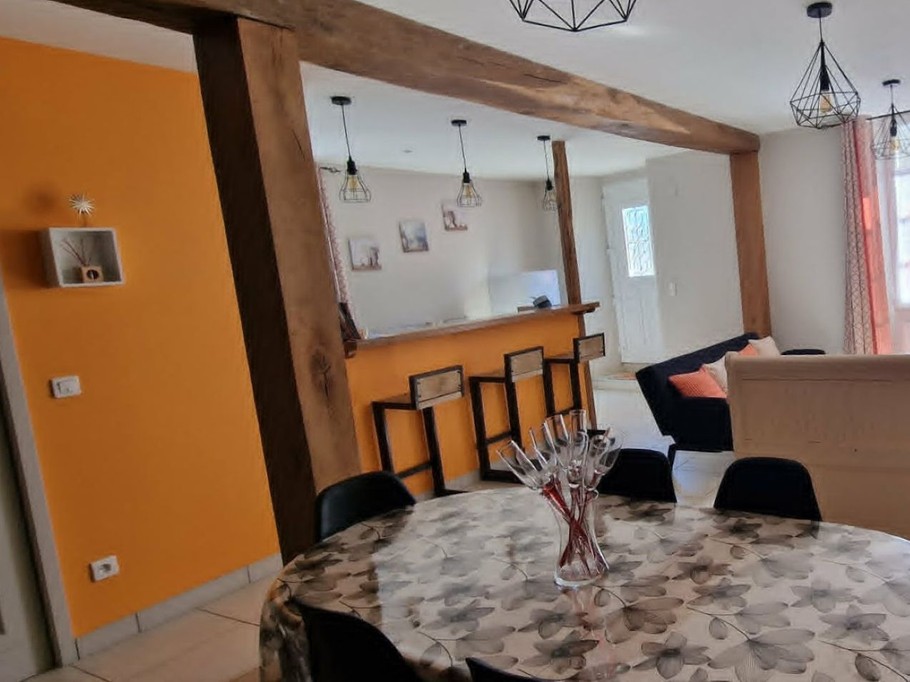 The 30 m² living room with fitted kitchen, lounge and dining area at Logis de La Passerelle in Port d'Envaux, Charente maritime.
