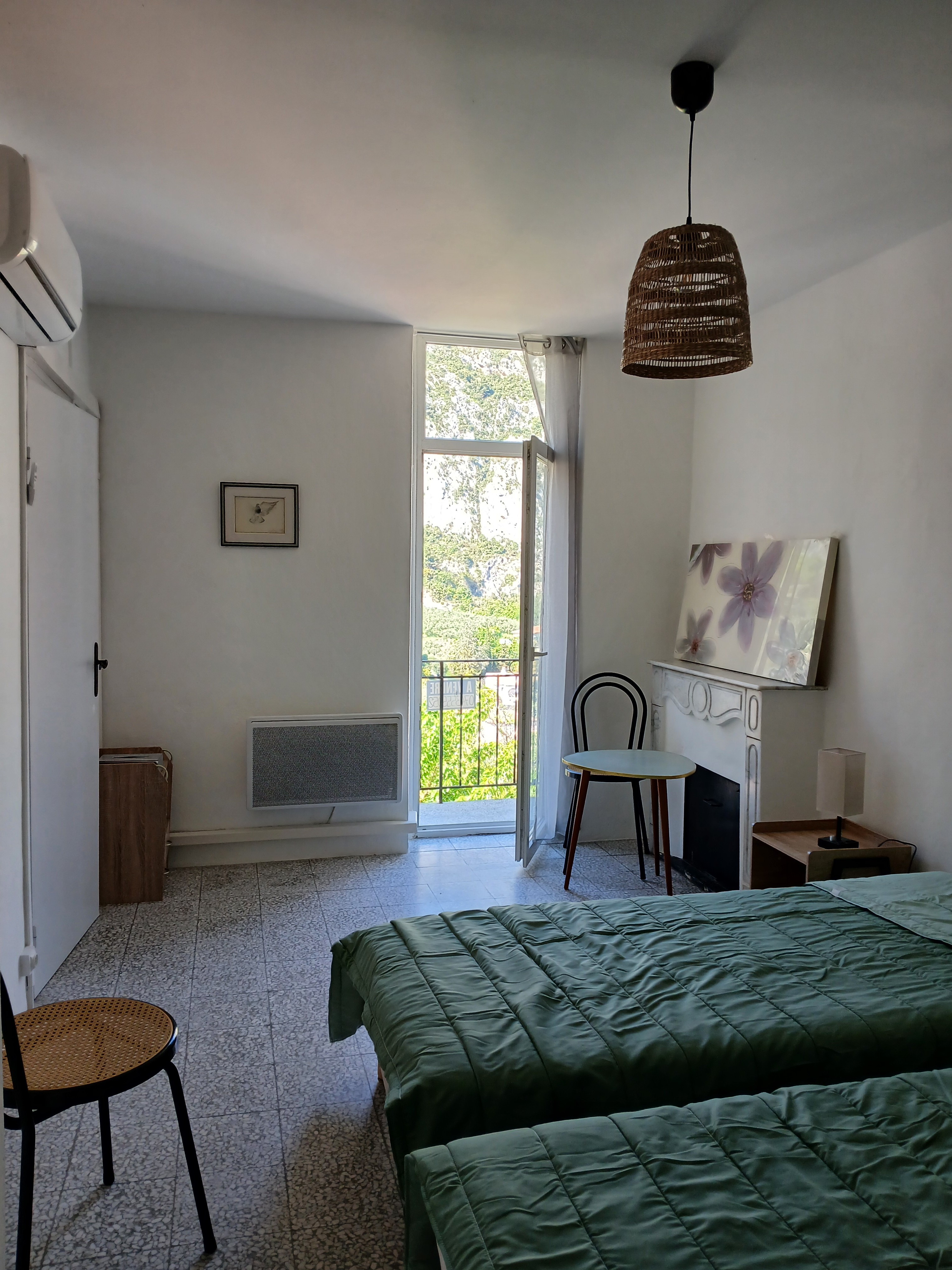 The bedroom with access to the balcony