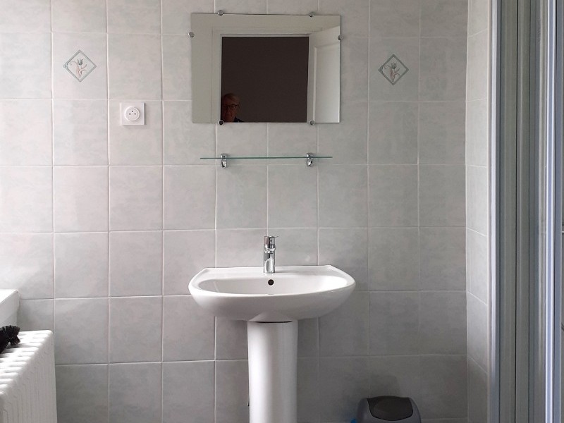 Shower room with shower, washbasin and washing machine. Separate WC.