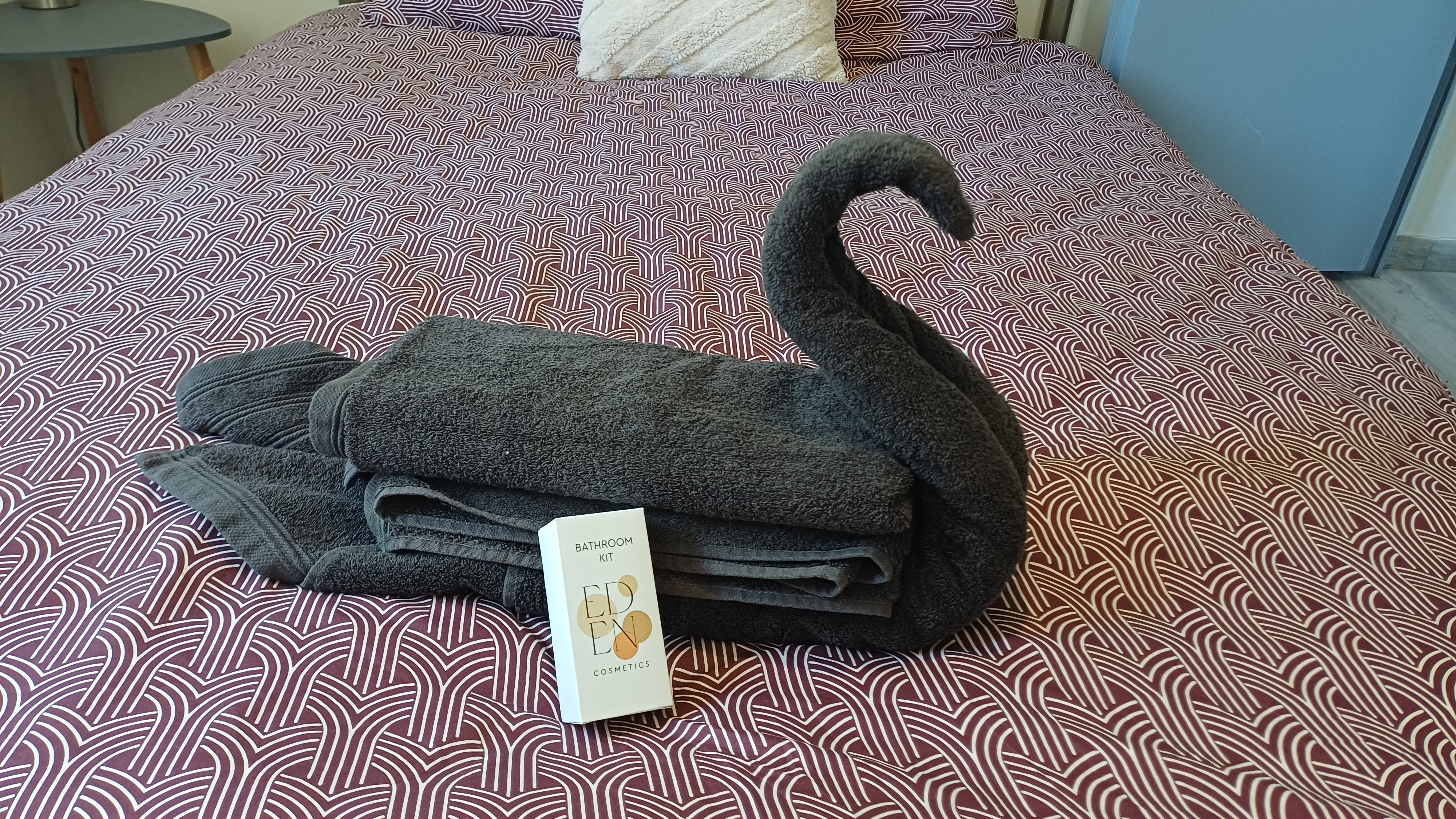 At the foot of the bed