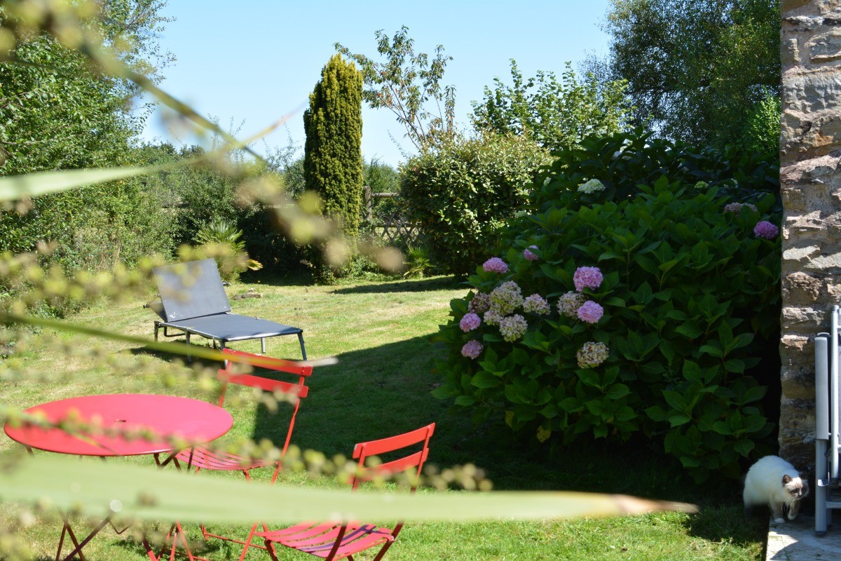 Private, enclosed garden with garden furniture, sun loungers and barbecue.