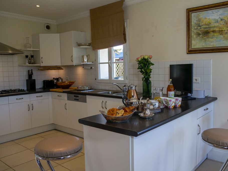 Kitchen opening onto dining room