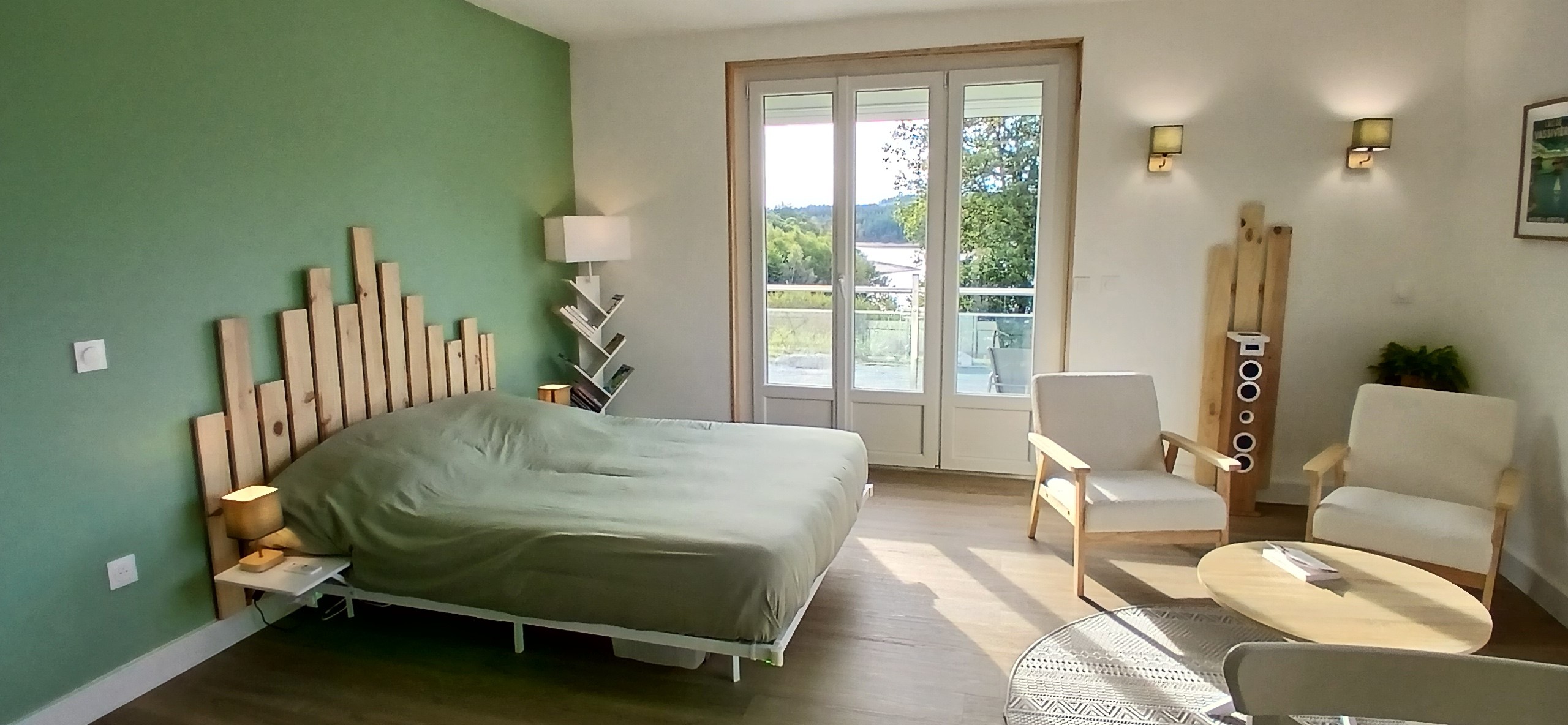 Le Nid – Holiday cottage, sleeps 2, Beaumont-du-Lac, Haute-Vienne: The sleeping area with a view of Lake Vassivière