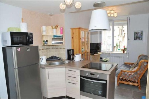 Fitted kitchen opening onto living room