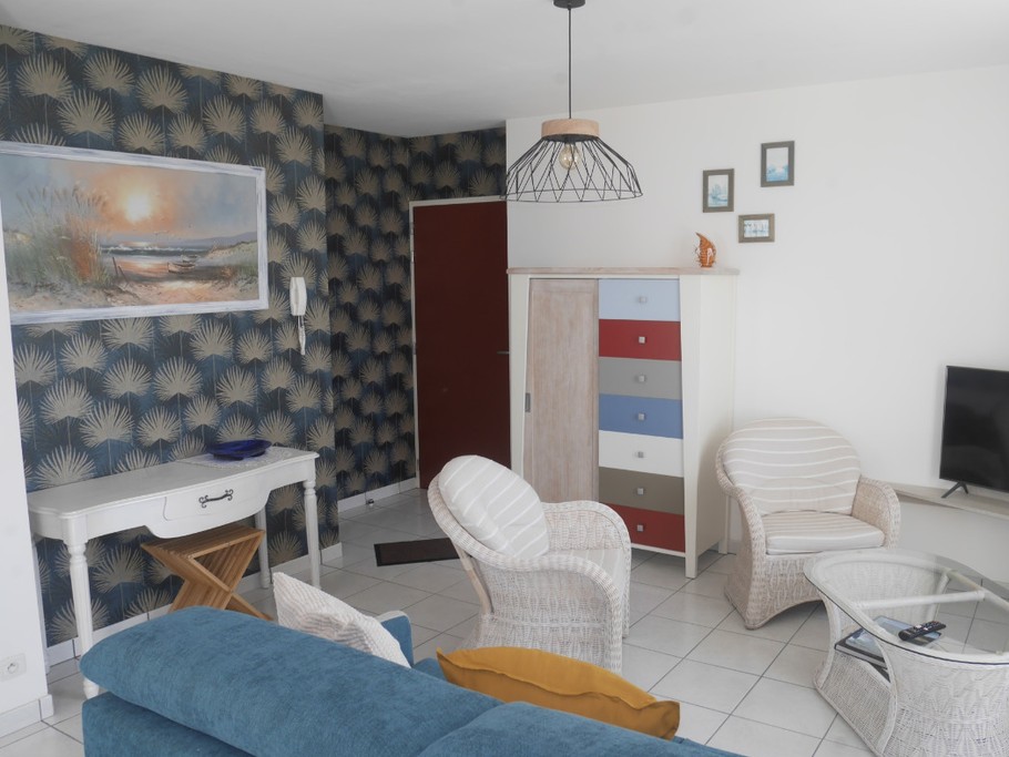 Salon avec canapé lit