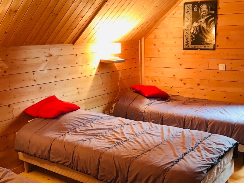 Bedroom 4 upstairs: three single beds + TV area
