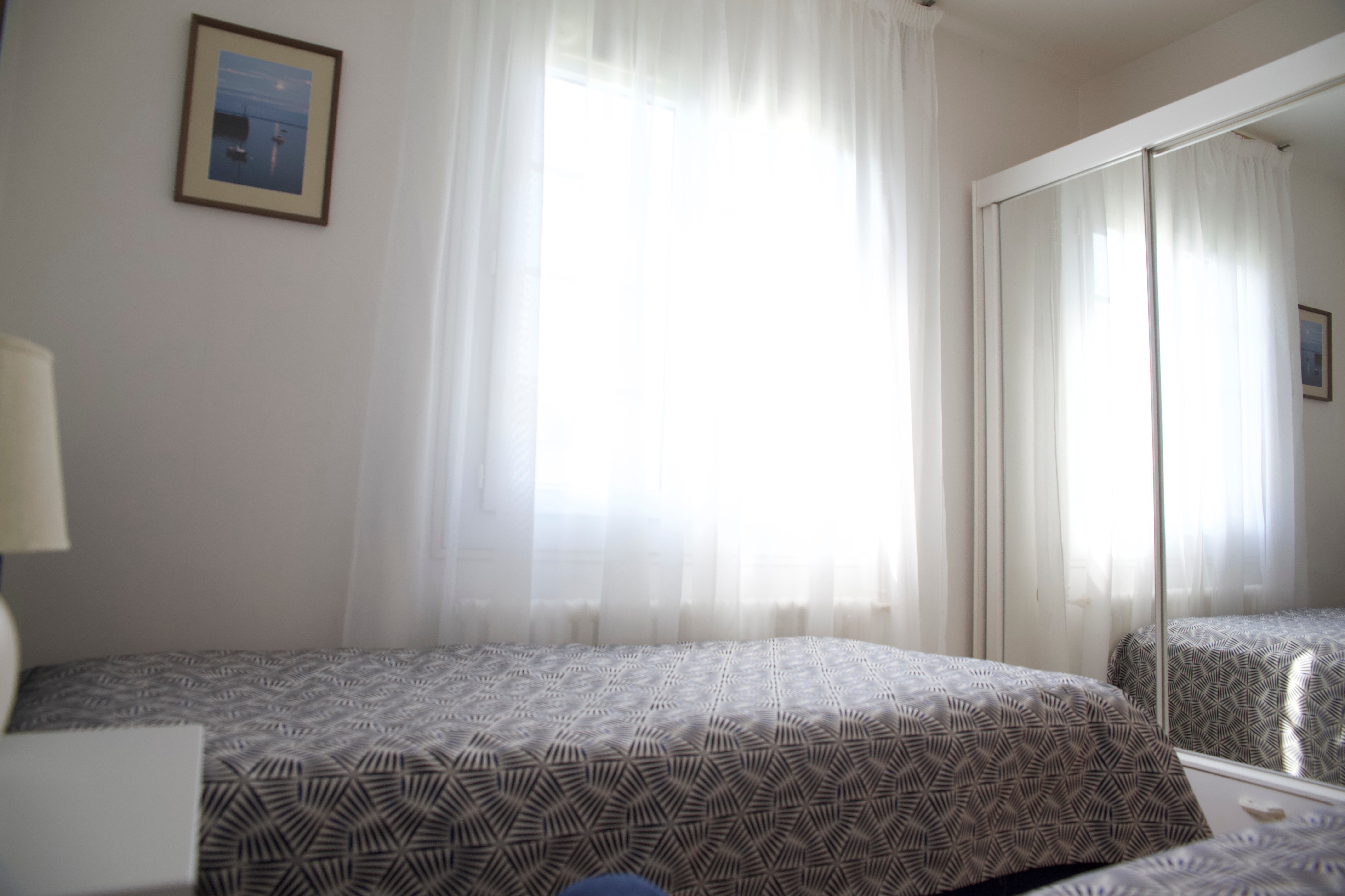 Bright bedroom opening onto the south-facing garden