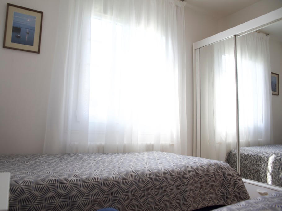 Bright bedroom opening onto the south-facing garden