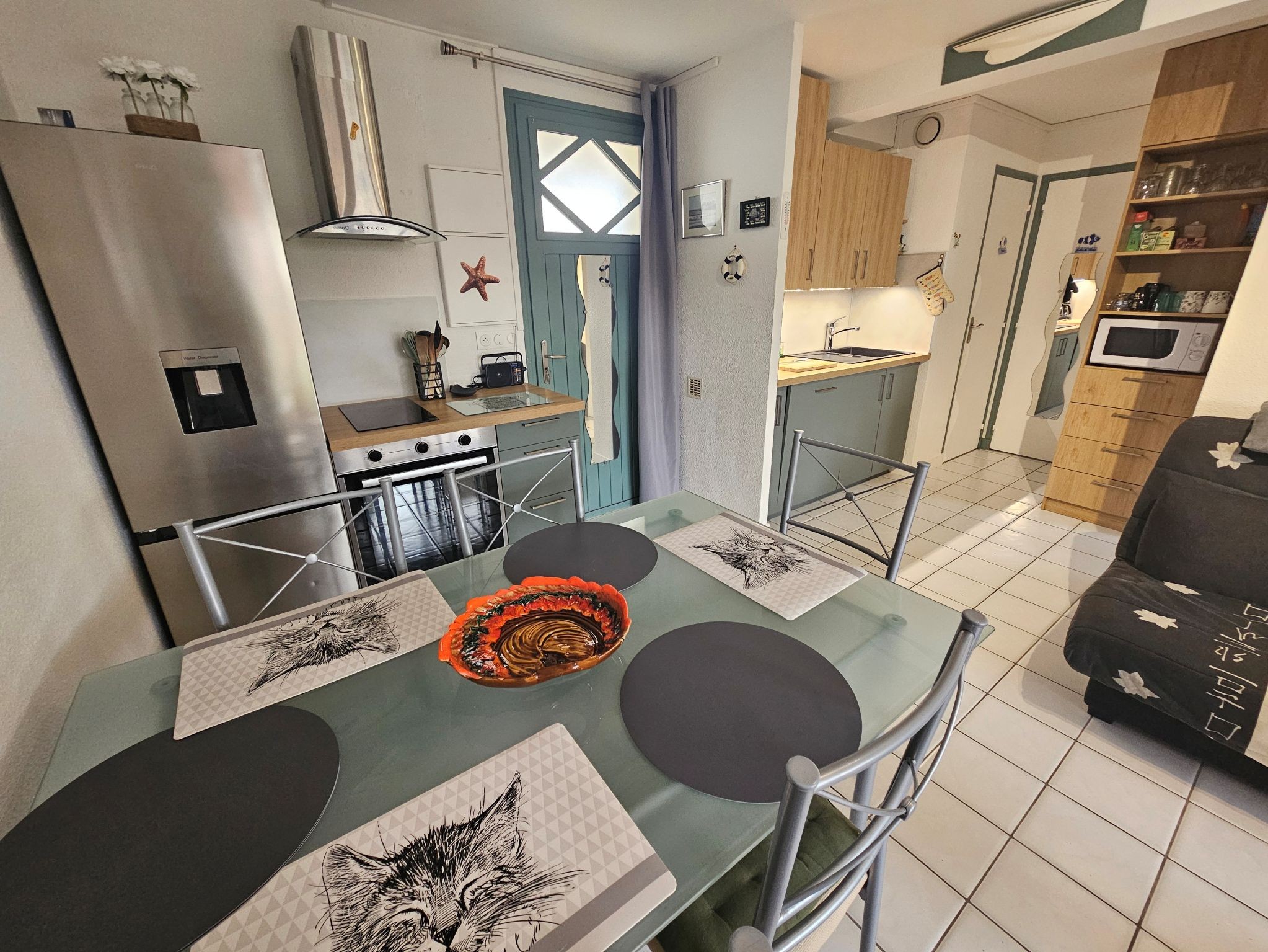 Fitted kitchen with table and chairs
