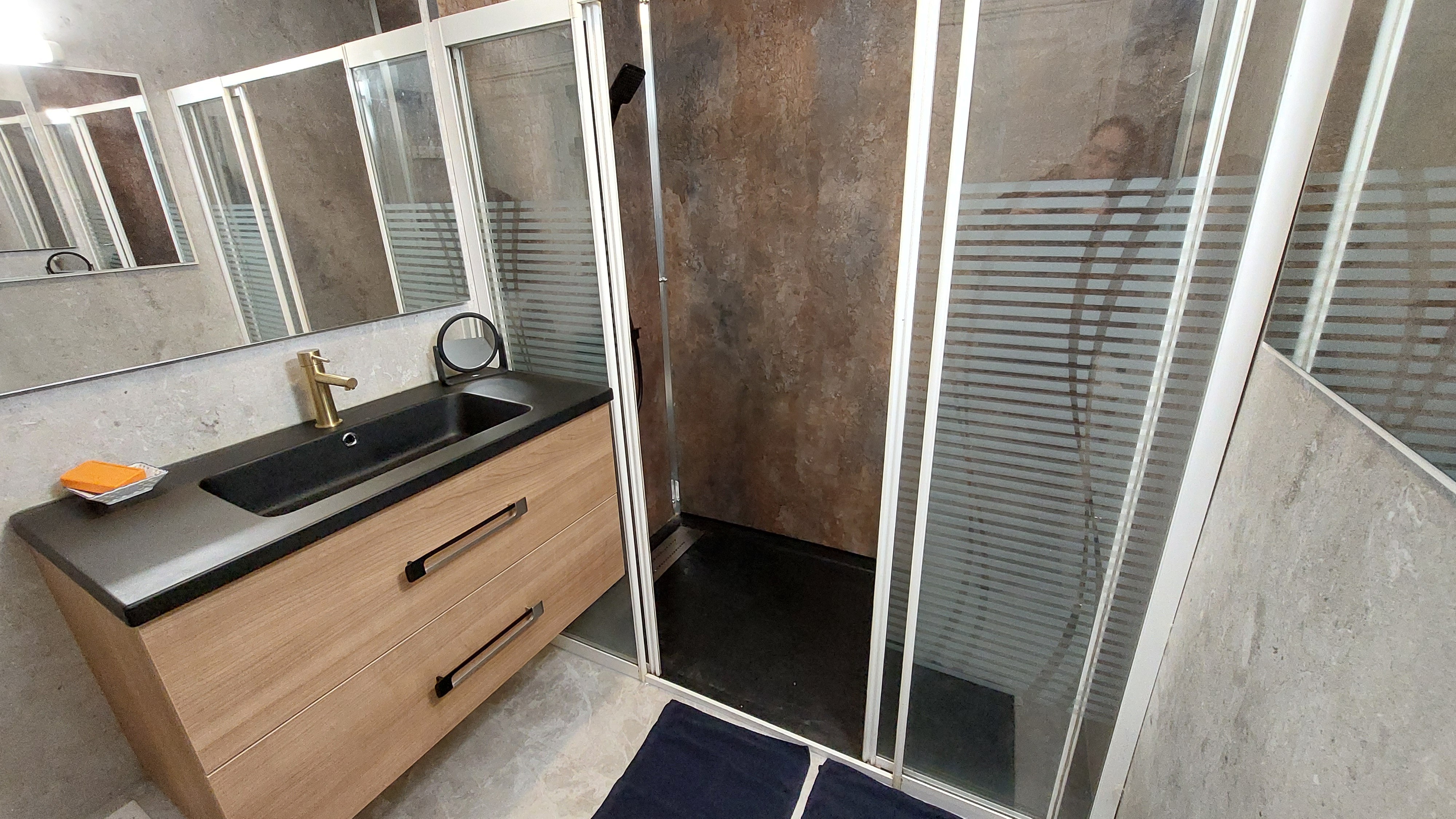 Bathroom with large modern shower in the gîte