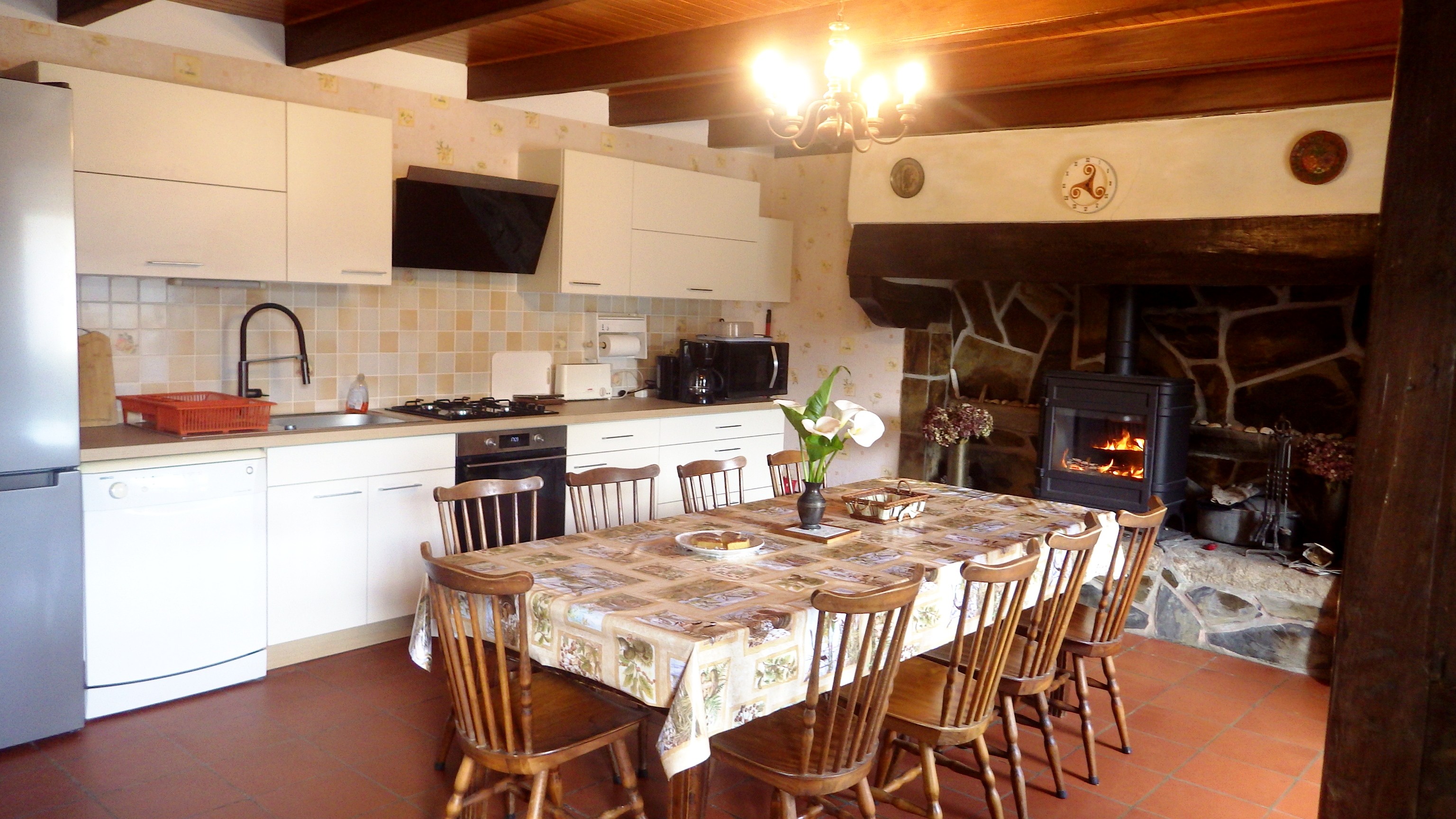 living room kitchen with wood-burning stove
