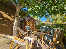 Raised terrace with disabled access, featuring relaxation areas and no neighbours opposite (apart from the goats!)