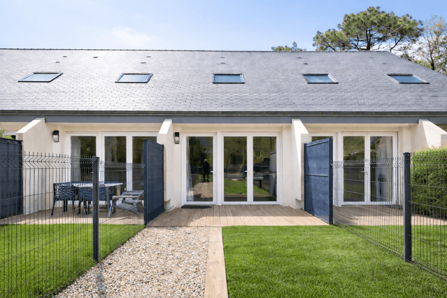 Front of the duplex house in a residence with swimming pool and tennis court