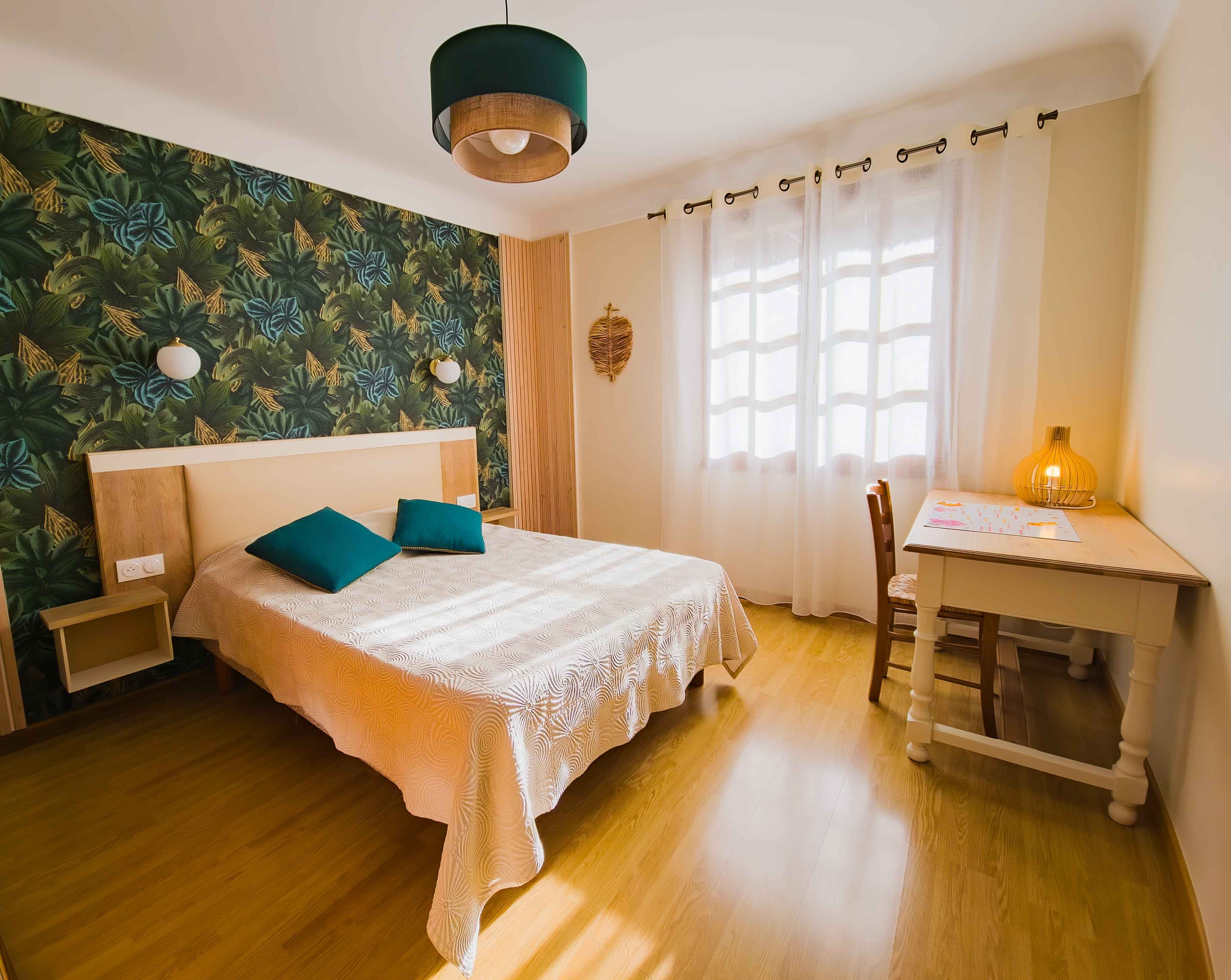 South-facing bedroom with a desk area for reading your emails.