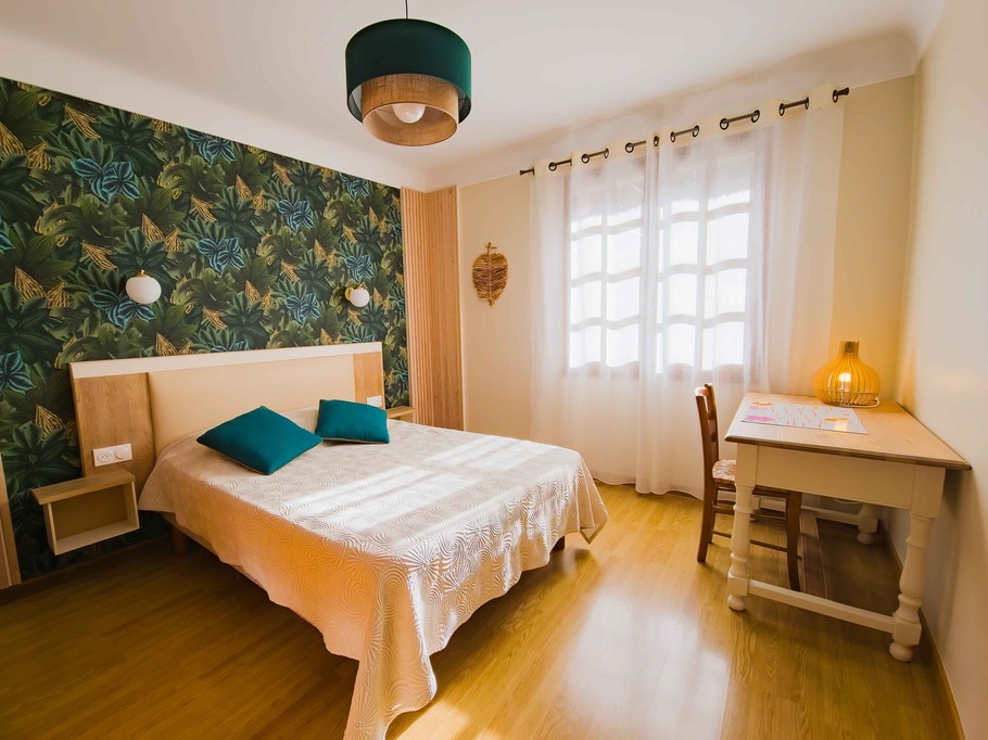 South-facing bedroom with a desk area for reading your emails.