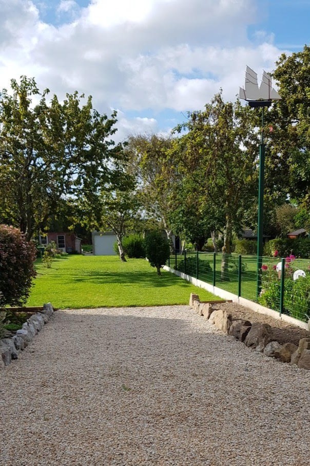 Pleasant long garden with trees