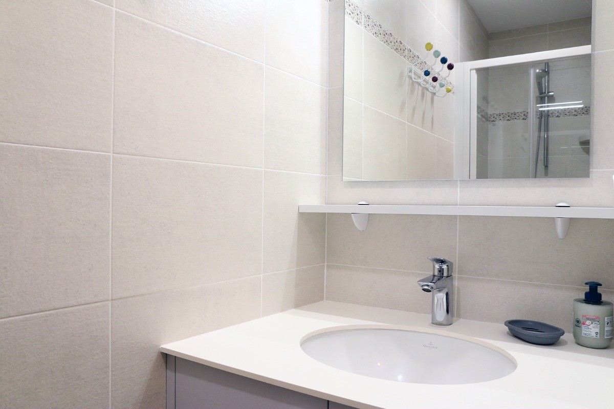 Bathroom with shower and vanity unit