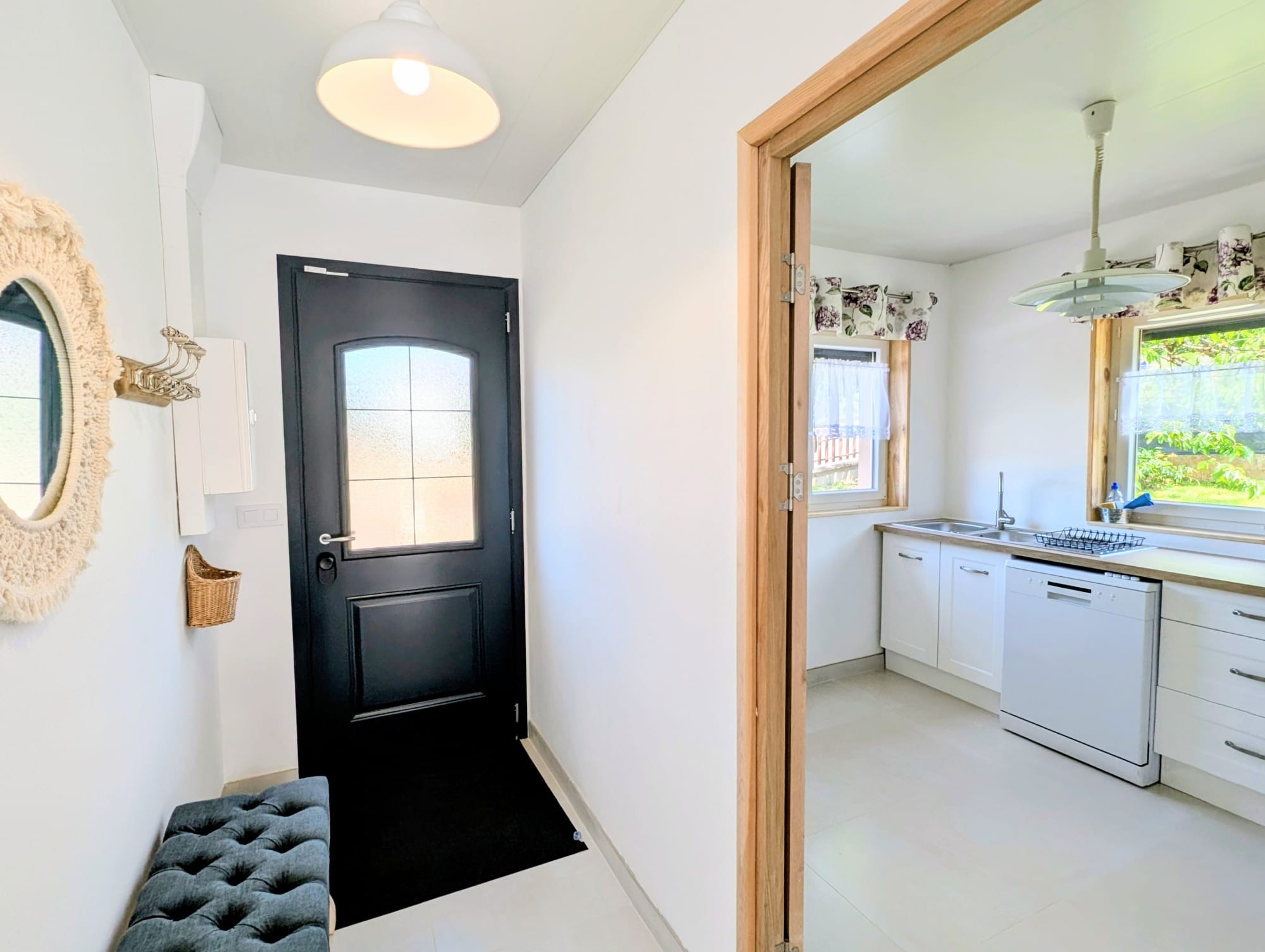 Entrance to the house adjoining the spacious, well-lit kitchen